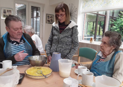 Residents baking a lemon meringue pie at Lulworth House 4