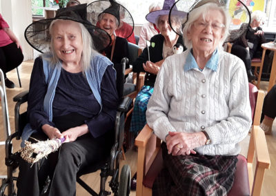 Lady residents at The Old Downs all wearing witches hats