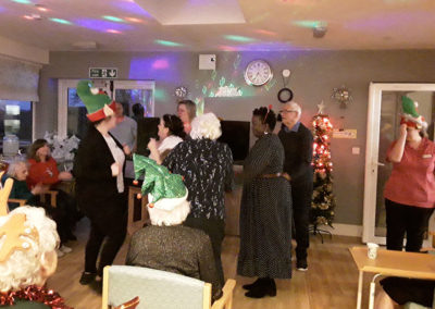 Residents and staff at The Old Downs on the dance floor at their Christmas party