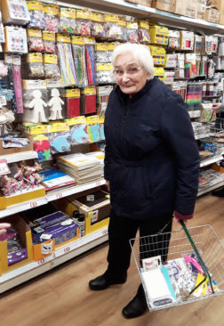 Lady resident of The Old Downs in a shop buying arts and crafts supplies