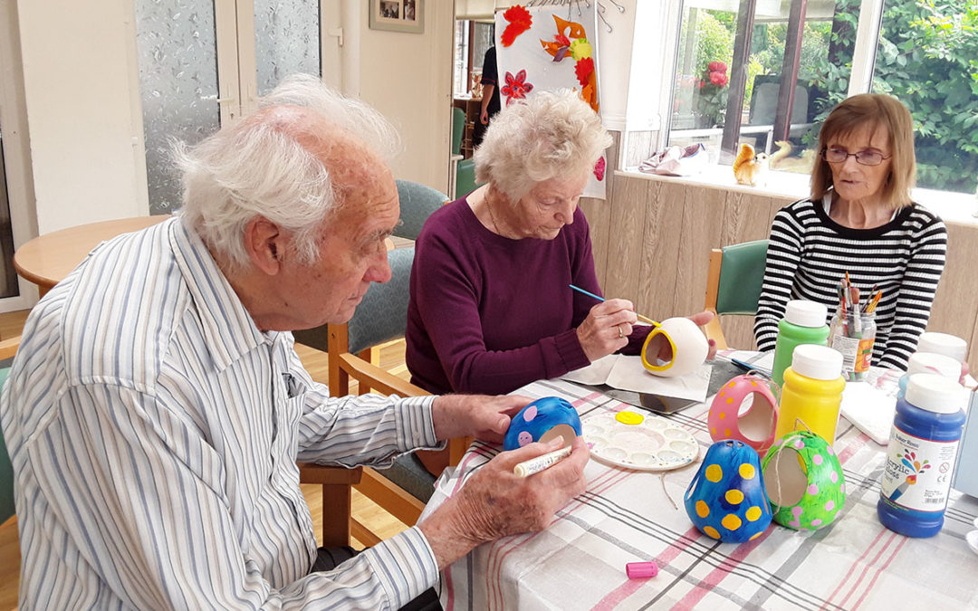Painting bird feeders at The Old Downs Residential Care Home