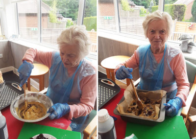 The Old Downs lady residents stirring ingredients for cherry bars