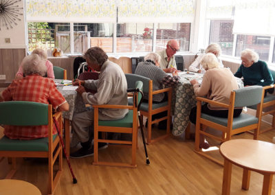 Residents making cards of gratitude together at The Old Downs Residential Care Home