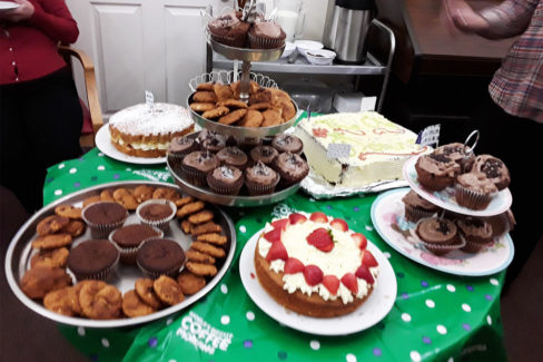 A table of cakes and cupcakes at a Macmillan Coffee Morning