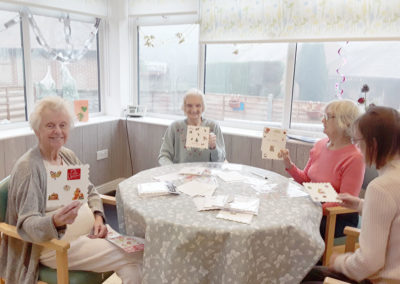 Christmas card decorating and writing at The Old Downs Residential Care Home