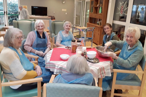 Ladies baking gingerbread biscuits at The Old Downs Residential Care Home
