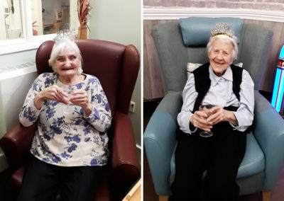 Two lady residents having News Year's drinks at The Old Downs Residential Care Home