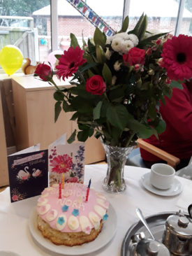 Cake, flowers and birthday cards for Norah at The Old Downs