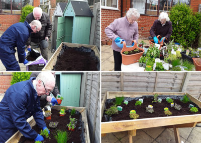 Residents gardening outside at The Old Downs Residential Care Home