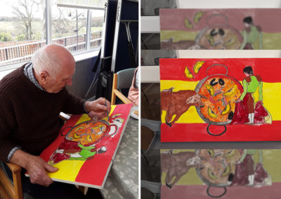 The Old Downs Residential Care Home resident paining a Spanish inspired canvas