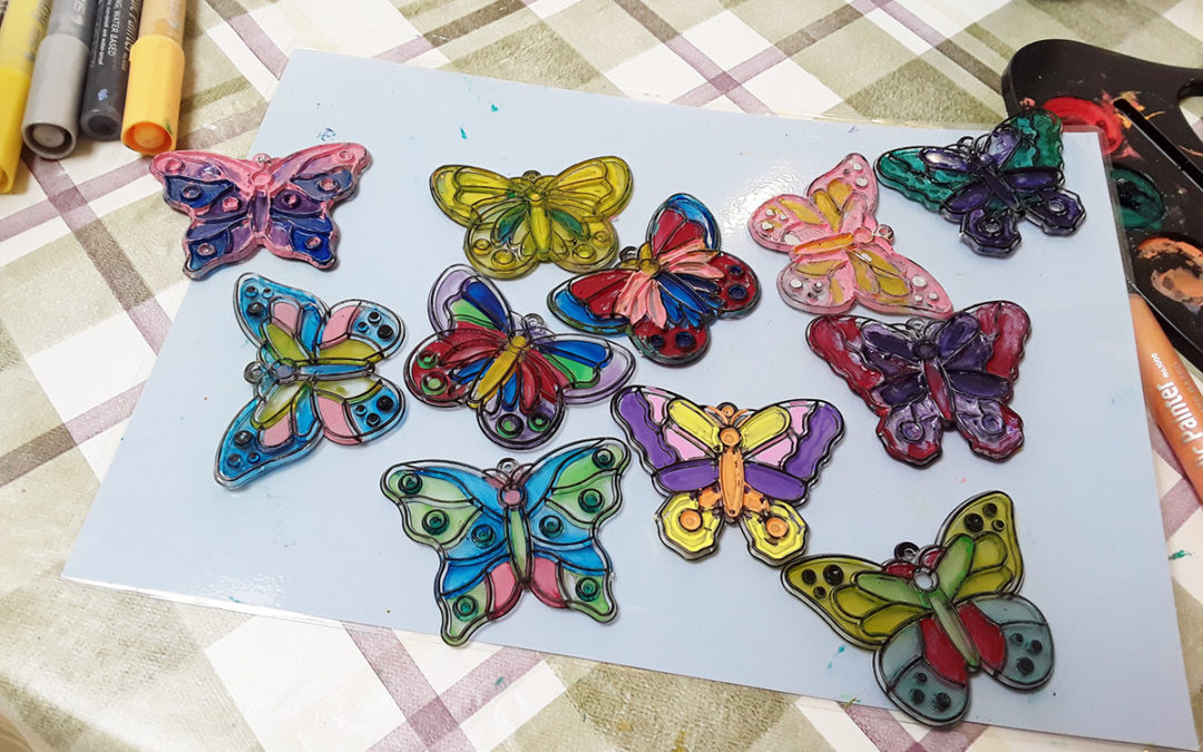 The Old Downs Residential Care Home residents paint butterfly sun catchers