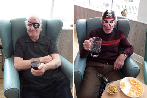 Residents enjoying a drink on Pirate Day at The Old Downs Residential Care Home