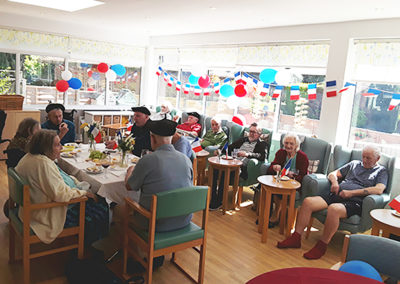 The Old Downs Residential Care Home dining room decorated with French themed bunting and balloons