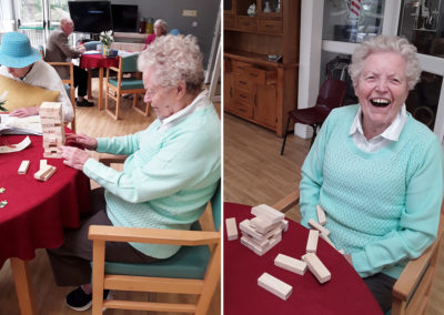 The Old Downs Residential Care Home resident playing with Jenga bricks