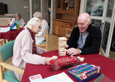 The Old Downs Residential Care Home residents having a game of Jenga