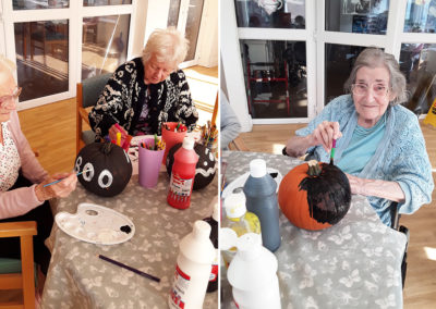 Residents enjoying pumpkin painting at The Old Downs Residential Care Home