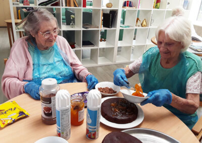 Cake decorating with jam at The Old Downs Residential Care Home