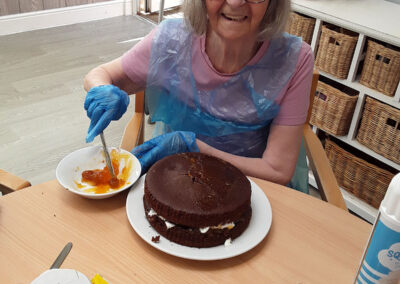 Cake decorating with apricot jam at The Old Downs Residential Care Home