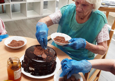 Cake decorating with chocolate at The Old Downs Residential Care Home