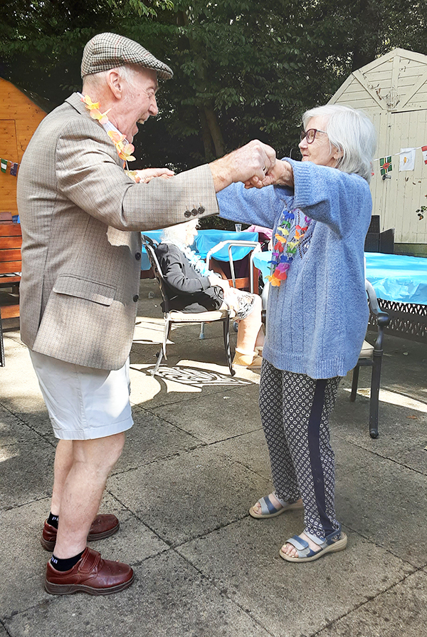 Dancing at a garden BBQ Party at The Old Downs Residential Care Home
