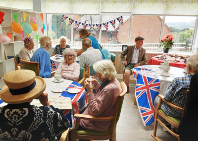 The Old Downs Residential Care Home residents enjoying their scones and sandwiches
