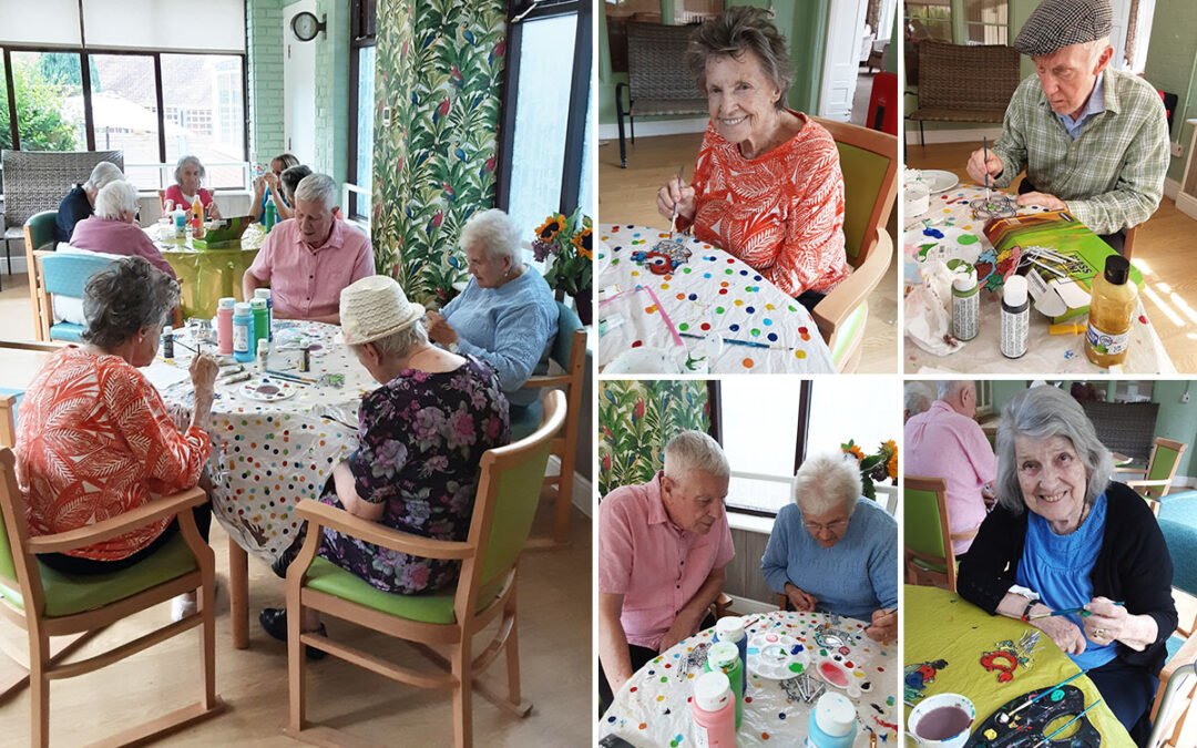 Decorating wind chimes at The Old Downs Residential Care Home