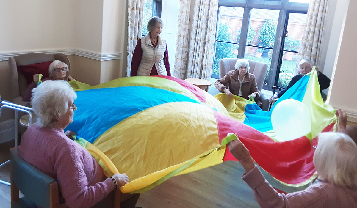 The Old Downs Residential Care Home residents enjoying a parachute game