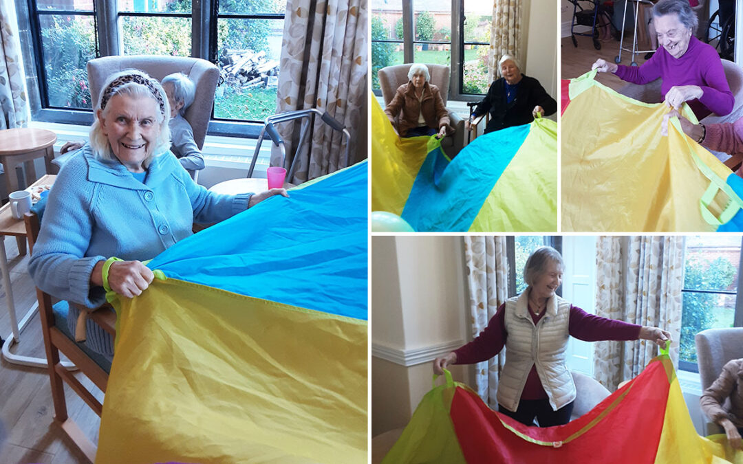 Parachute game and balloon tennis at The Old Downs Residential Care Home