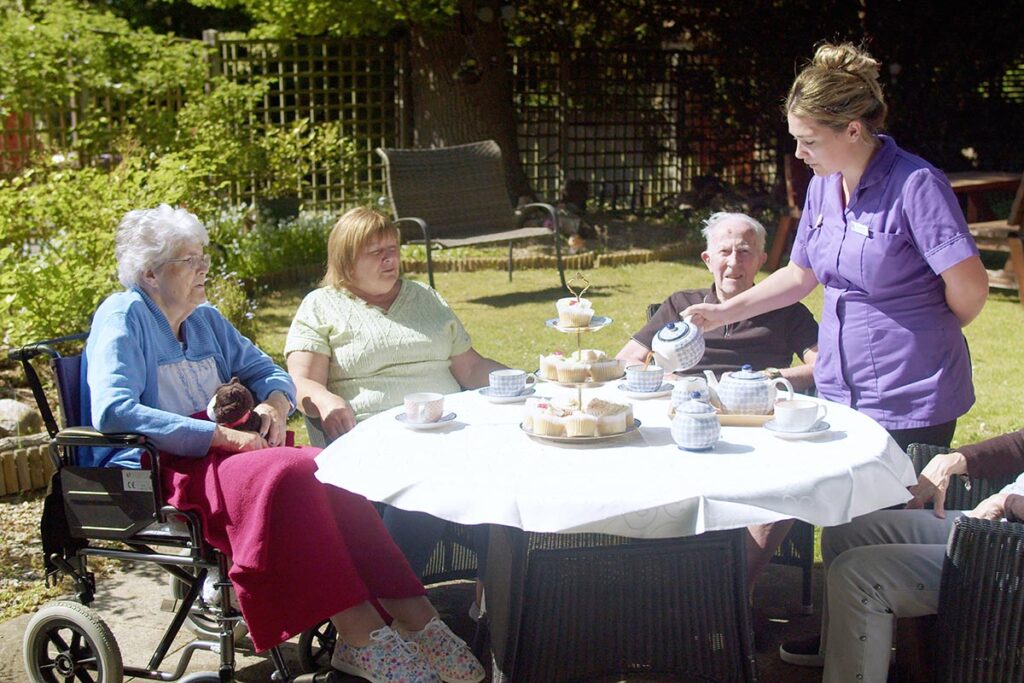 Afternoon tea in the garden at The Old Downs Residential Care Home