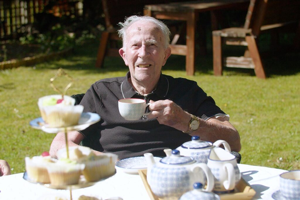 Afternoon tea in the garden at The Old Downs Residential Care Home
