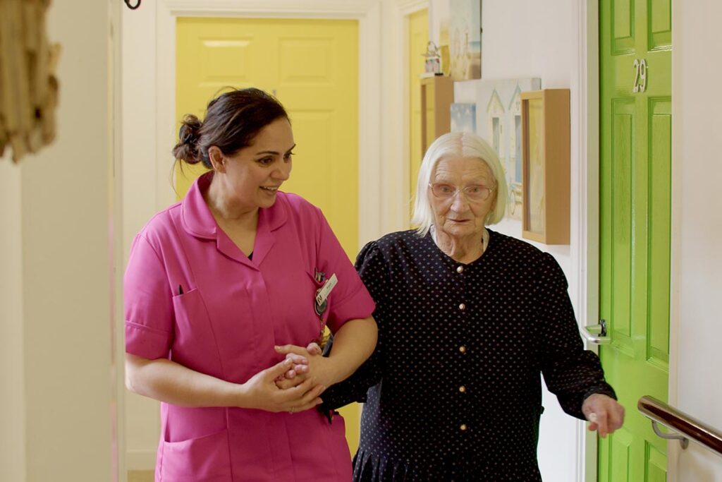 One of our residents and team members at The Old Downs Residential Care Home