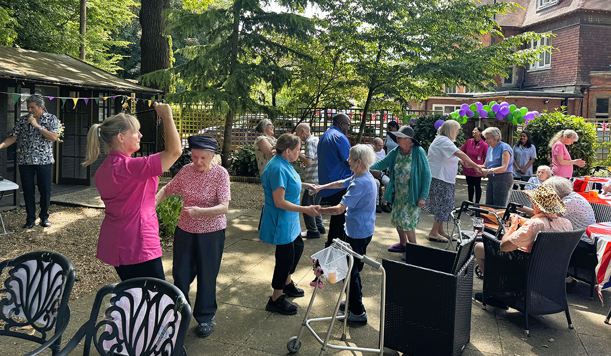 Dancing in the garden at The Old Downs Residential Care Home