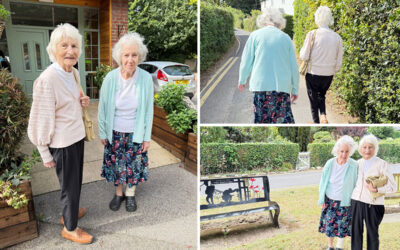 Two lady residents from The Old Downs Residential Care Home sharing a daily walk together in the local community.
