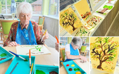 The Old Downs Residential Care Home lady residents painting autumnal tree pictures using rich paint colours on coloured card.