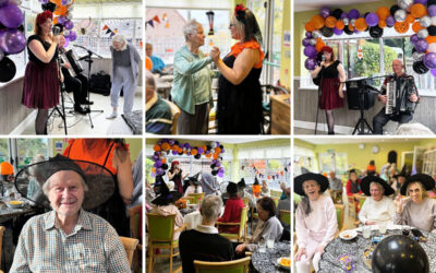 Our residents at The Old Downs Residential Care Home celebrating Halloween with live music, colourful decorations, and festive treats.