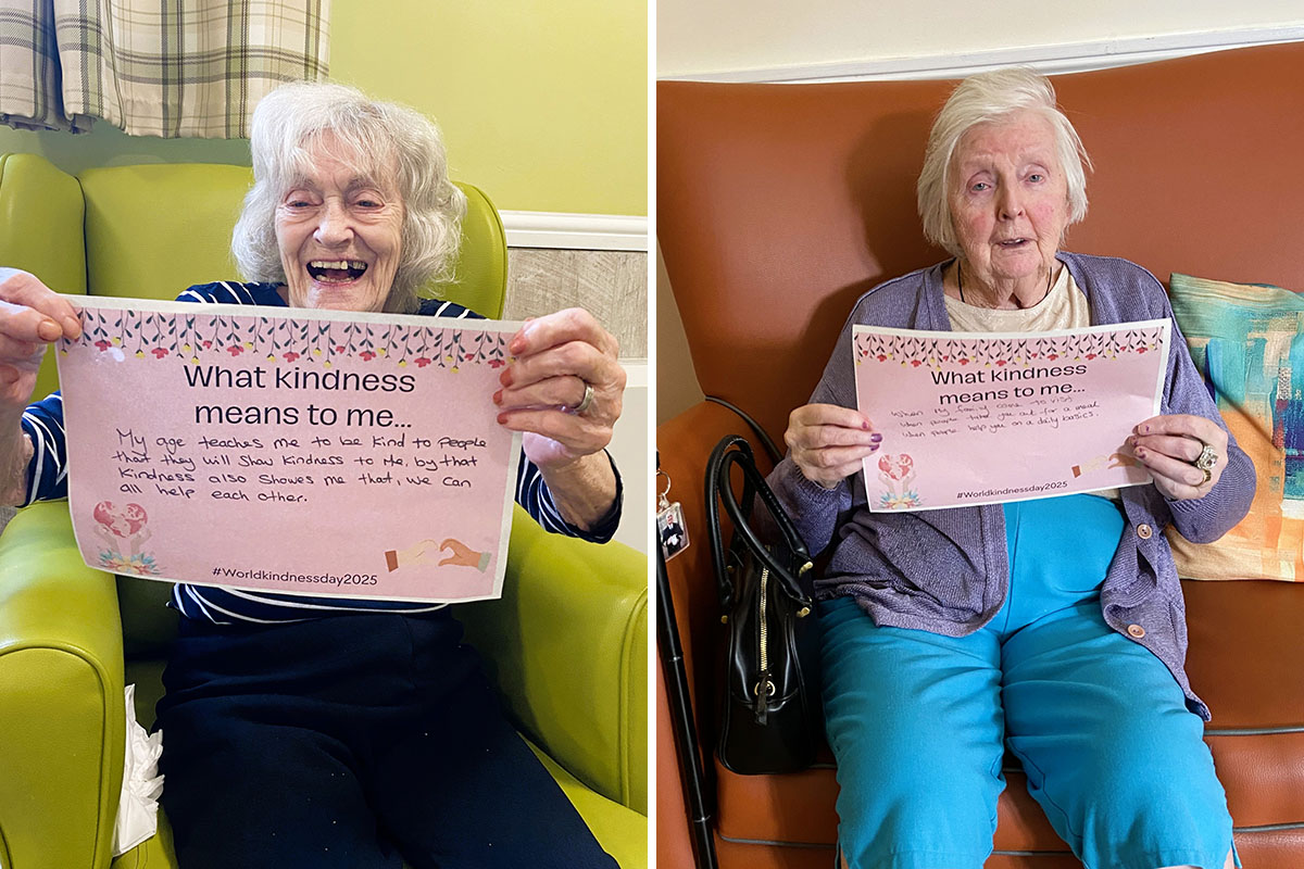 Residents at The Old Downs Residential Care Home smiling as they take part in a World Kindness Day 2025 activity, sharing personal reflections on kindness.