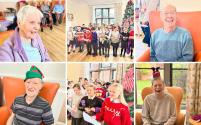Primary School choir children dressed in festive jumpers performing carols for delighted residents at The Old Downs Residential Care Home.
