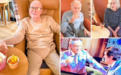 Residents at The Old Downs Residential Care Home enjoying a January film evening with snacks.